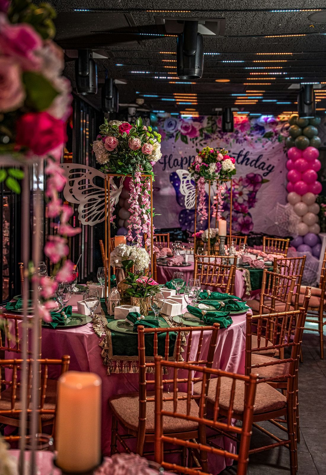 A debut party set up with flowers and balloons