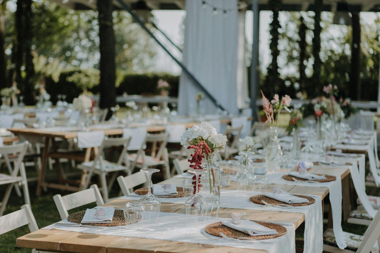 Long tables set in the pavilion